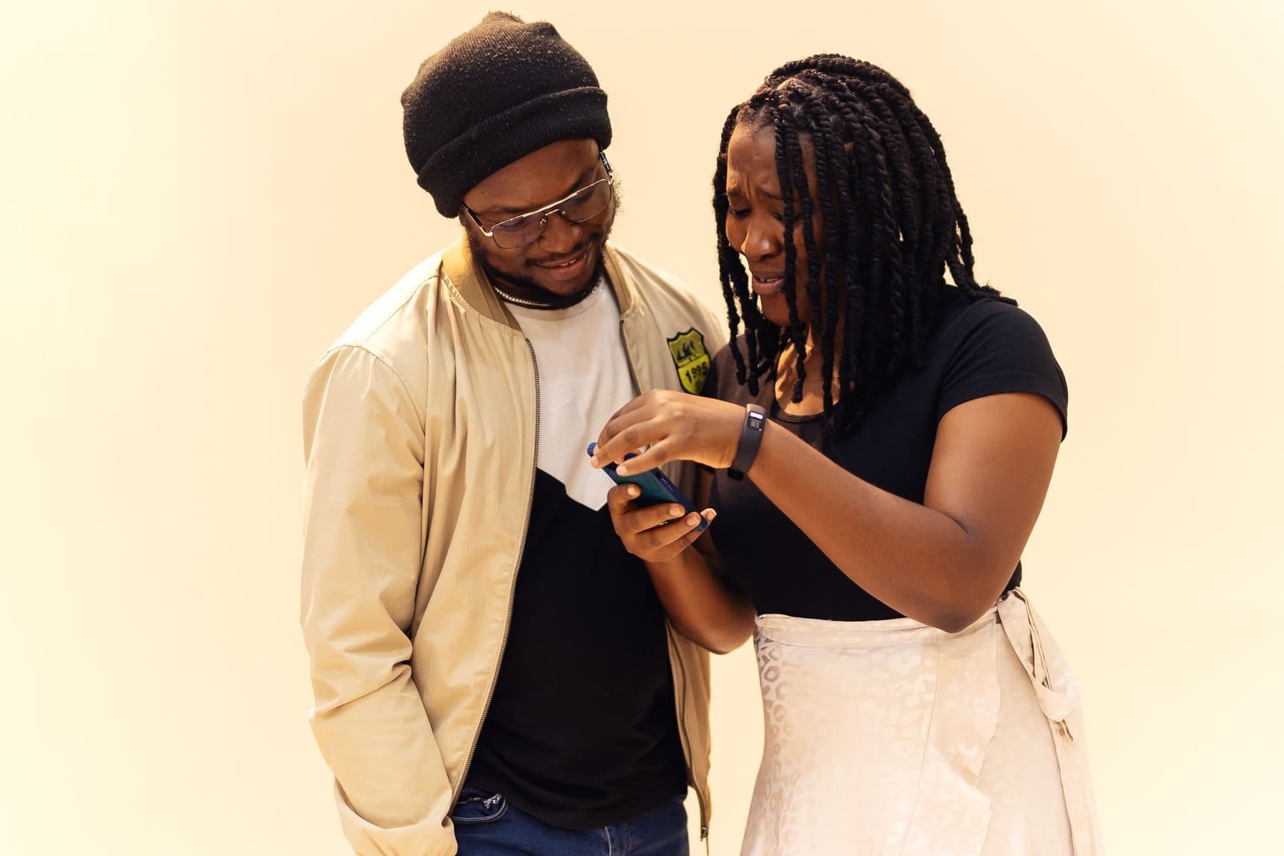 Two people reviewing research results together on a laptop